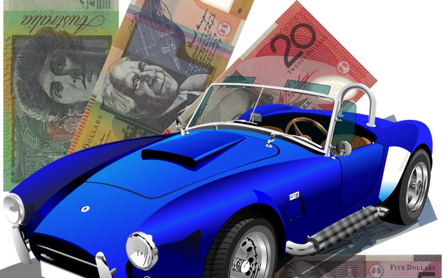 Old blue car with cash behind it, showing we deal with kind of car or vehicle